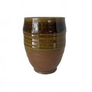 Signed contemporary studio pottery mug by Terry Plasket with textured glaze.